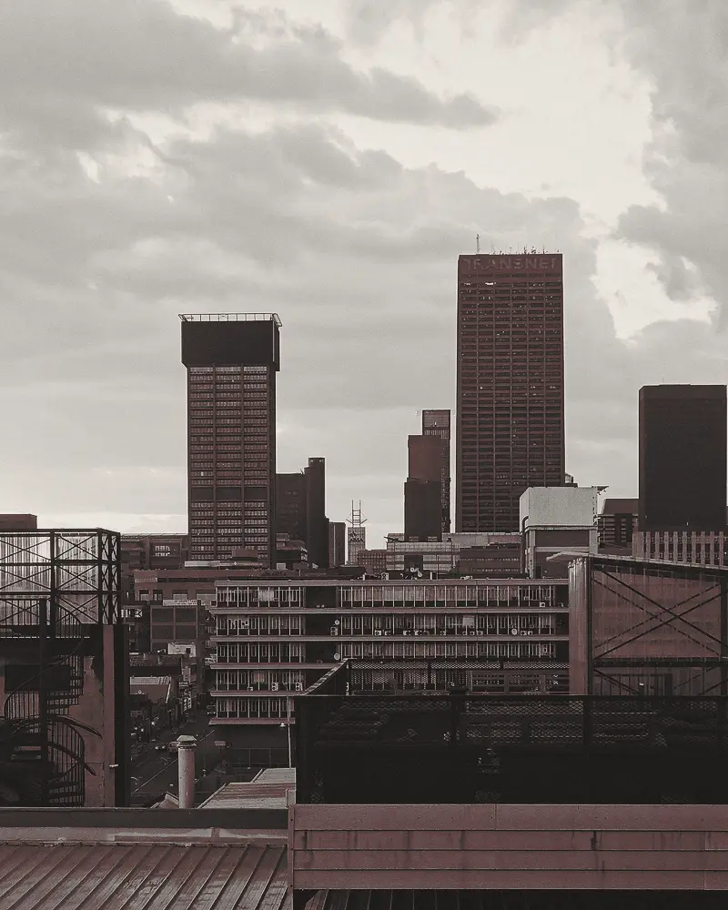 Johannesburg CBD skyline under a heavy sky.
